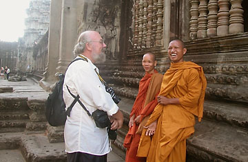 Gary and two Buddhist monks at Angkor Wat in Cambodia